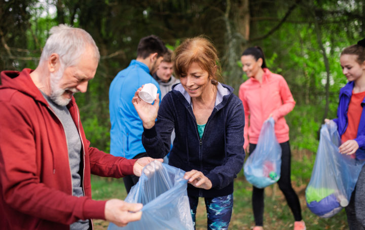 Group of people picking up litter